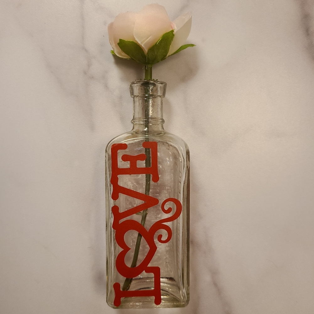 Antique bottle with vinyl art